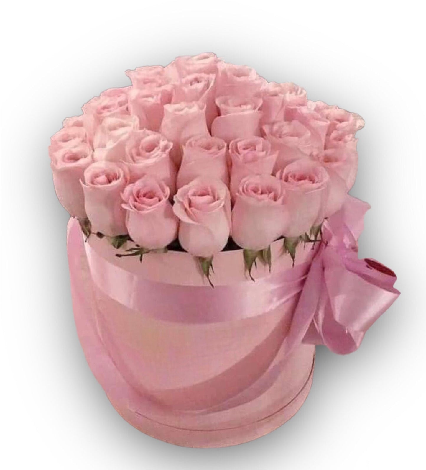 Pink ShaElegant round pink box filled with soft pink roses and tied with a satin ribbon bow, photographed on a clean white background with the watermark "flowershopping.gr" in dark grey letters at the bottomdes