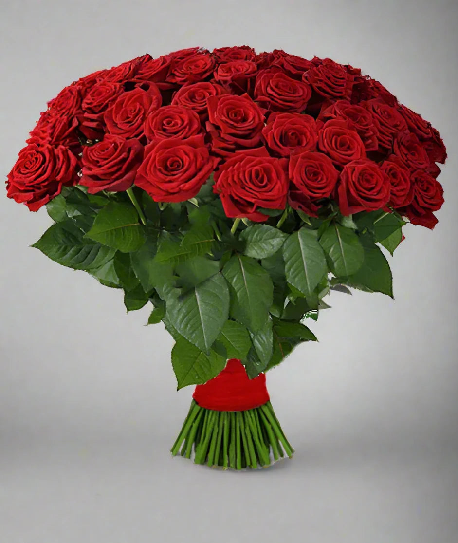 A lush bouquet of vibrant red roses, elegantly tied with a ribbon. Perfect for expressing love, appreciation, or celebration. Send this beautiful arrangement to Athens, Greece, and brighten someone’s day!”