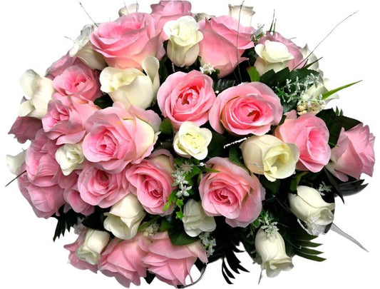 a beautiful floral arrangement primarily composed of roses. Among the roses, you’ll find both pink and white varieties