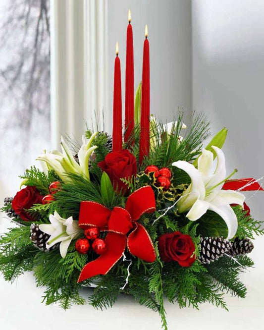 christmas flower arrangment for athens delivery from athens flowershop flowershopping.gr with candles and greenery and red roses