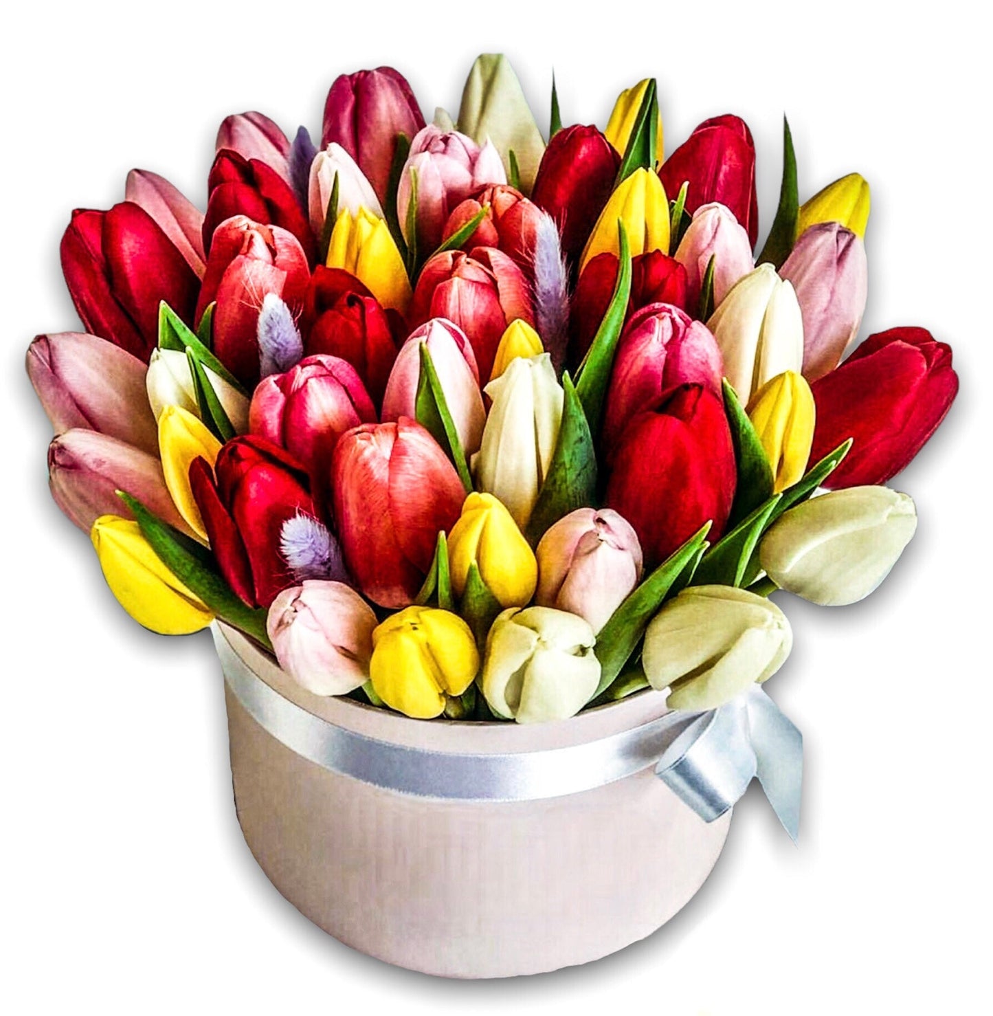 a large bouquet of tulips in various colors, including red, yellow, white, and purple. These tulips are arranged in a round silver pot with a handle